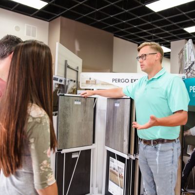 Greer Flooring sales team helping local customers choose luxury vinyl floors at our Greer showroom