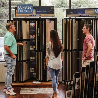 Greer Flooring showroom sales team helping customers choose luxury vinyl