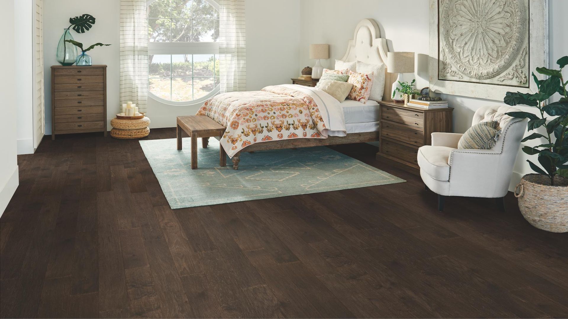 dark stained hardwood floors in a calming bedroom